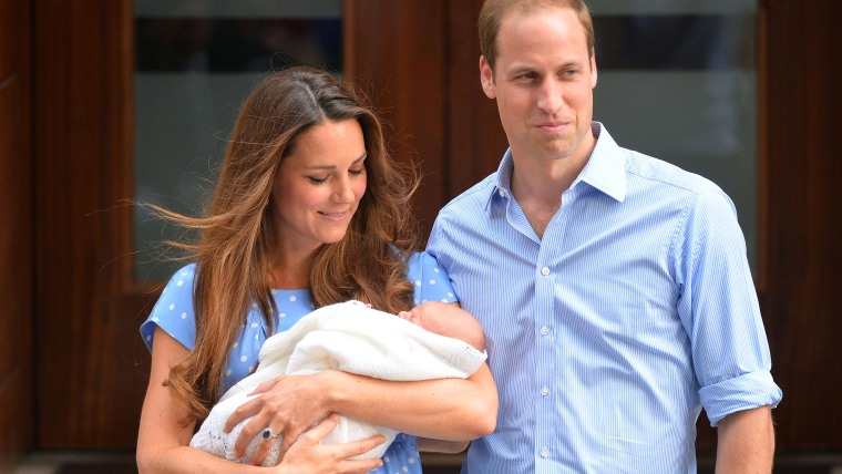(FILES) A file picture taken on July 23, 2013, shows Catherine, Duchess of Cambridge, (L) and Prince William posing for pictures with their new baby s...