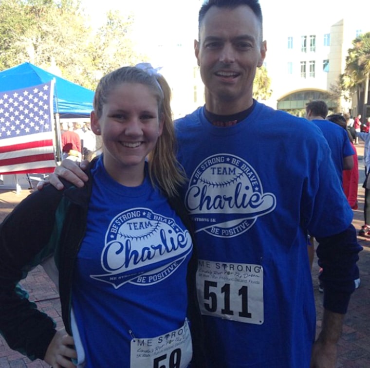 Teacher Charles Lundell, known as Charlie, with student Savannah Bendik at a cancer 5k race last year. Students wore team Charlie shirts and supported...