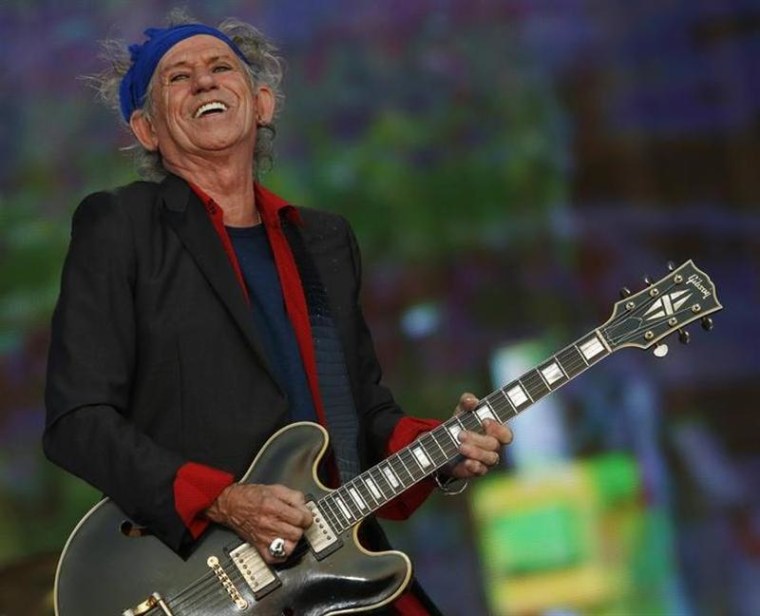 Keith Richards of the Rolling Stones performs at the British Summer Time Festival in Hyde Park in London July 6, 2013. REUTERS/Luke MacGregor