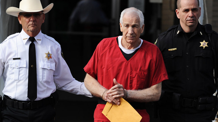 BELLEFONTE, PA - OCTOBER 09: (Best Of 2012)  Former Penn State assistant football coach Jerry Sandusky (C) leaves the Centre County Courthouse after b...