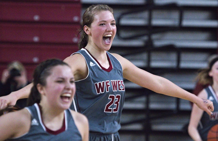 W.F. West's Julie Spencer (23) runs to the bench as time expires in the girls' 2A state basketball championship game against Mark Morris, Saturday, Ma...