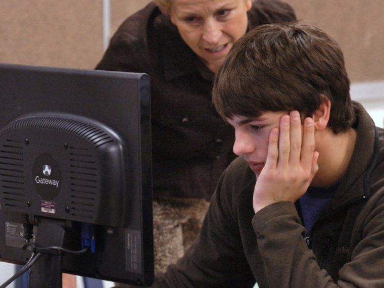 Getting into college is a rigorous process, and that should include looking for the right scholarships. Project Leadership board member and volunteer Jacquie Dodyk, left, helps Tanner Williams and other seniors fill out college application forms in this 2011 photo.