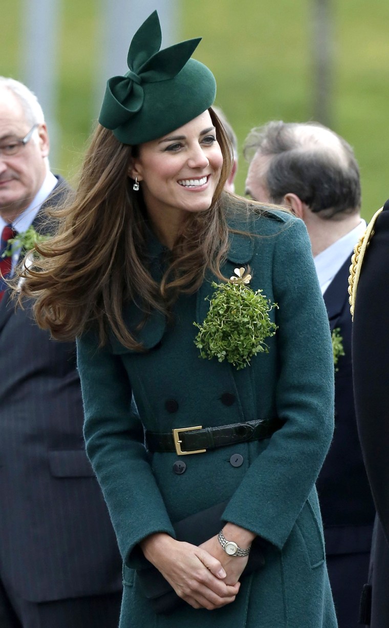 Britain's Catherine, Duchess of Cambridge wears a sprig of shamrock during  a visit with her husband Prince William to the 1st Battalion Irish Guards ...
