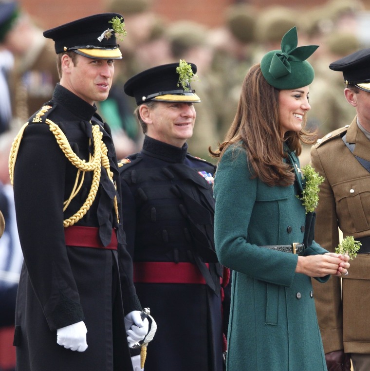 Prince William looks on as the Duchess of Cambridge presents shamrocks to the Irish Guards during the St Patrick's Day Parade on March 17.