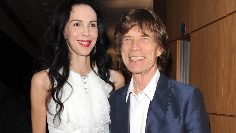 LONDON, UNITED KINGDOM - JULY 11: L'Wren Scott and Mick Jagger attend the private view of 'The Suzy Menkes Collection: In My Fashion' at Christie's on...