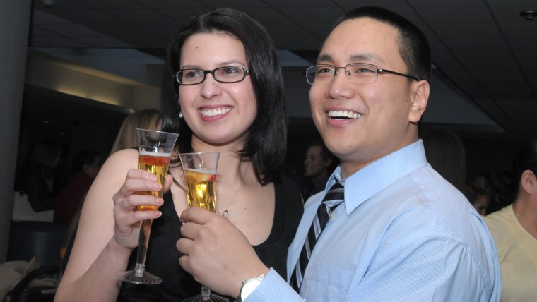 The newly engaged couple toast the day.