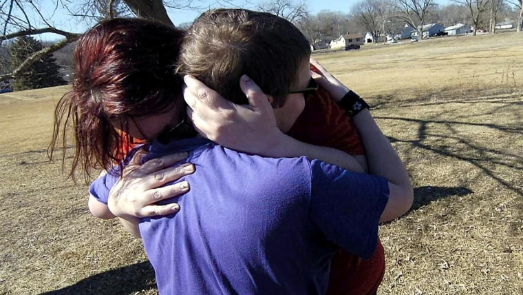 Corbin Crawford and his mother shared a hug after his rescue.