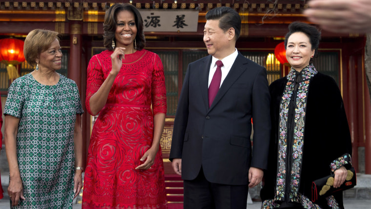 U.S. first lady Michelle Obama, second from left, her mother Marian Robinson, left, share a light moment with Chinese President Xi Jinping, second fro...