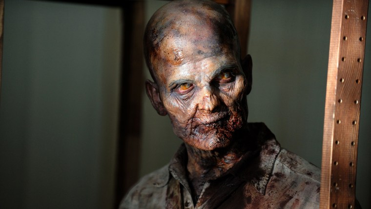 This undated publicity photo provided by AMC shows a zombie in a scene from AMC's TV show, \"The Walking Dead,\" Season 3, Episode 1. The show airs Sund...