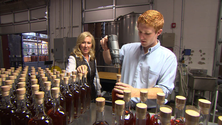 Troy Ball working with son Luke at distillery