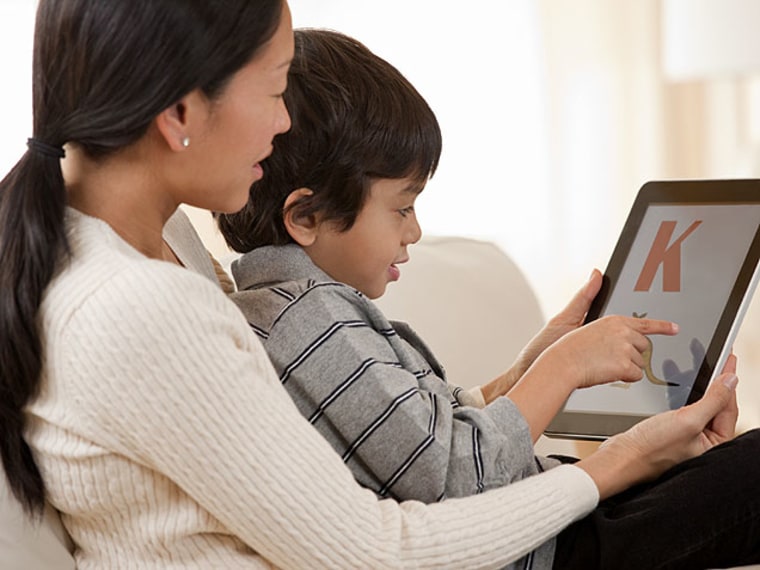 Boy and mom with iPad - Best Learn-to-Read Apps for Kids