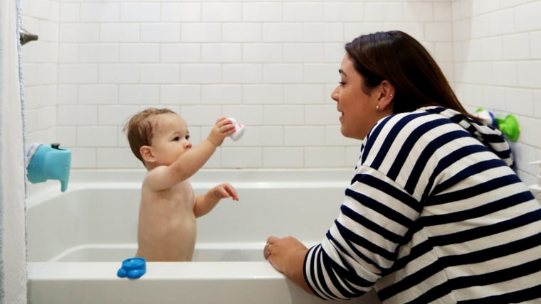 Image: Kelly Hofstra gives her son, Mason,1, a bath at their home in San Diego, Calif., May 2.