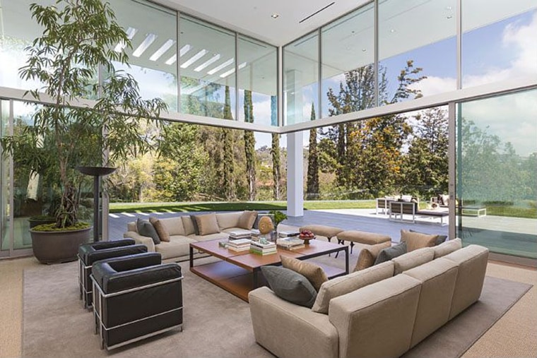 Walls of glass and sliding doors give each space a grand, luxurious feel.