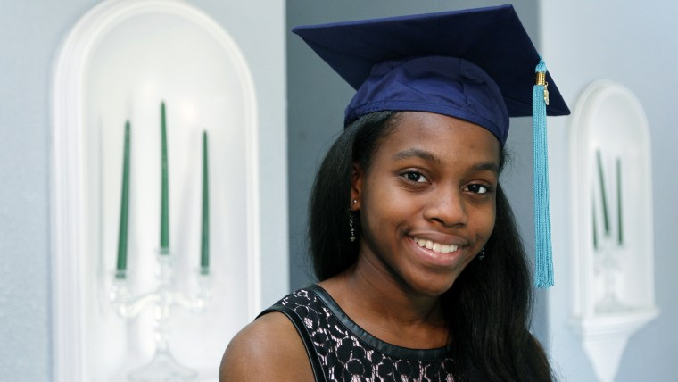 Grace Bush poses in her university graduation cap.