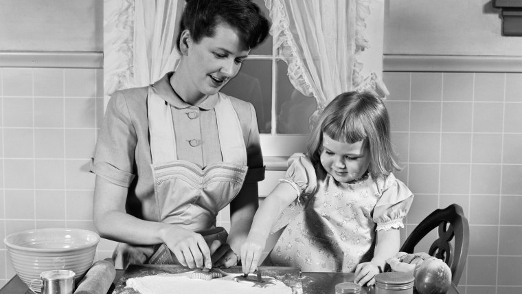 1950s MOTHER  DAUGHTER BAKING TOGETHER IN KITCHEN CUTTING DOUGH WITH COOKIE CUTTERS  /H. ARMSTRONG ROBERTS/CLASSICSTOCK/Everett Collection