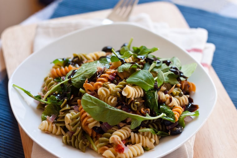 Warm pasta salad with tuna, olives and capers