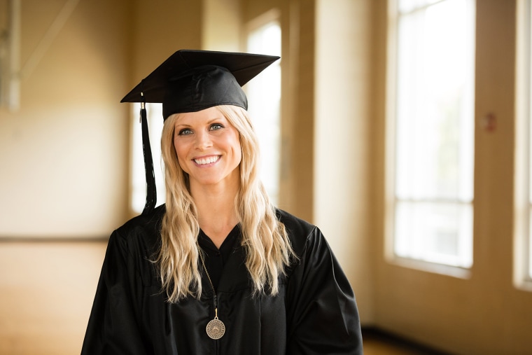 Elin Nordegren, the ex-wife of Tiger Woods, poses after receiving the Outstanding Graduating Senior Award for the Class of 2014 during her May 10 graduation from Rollins College.