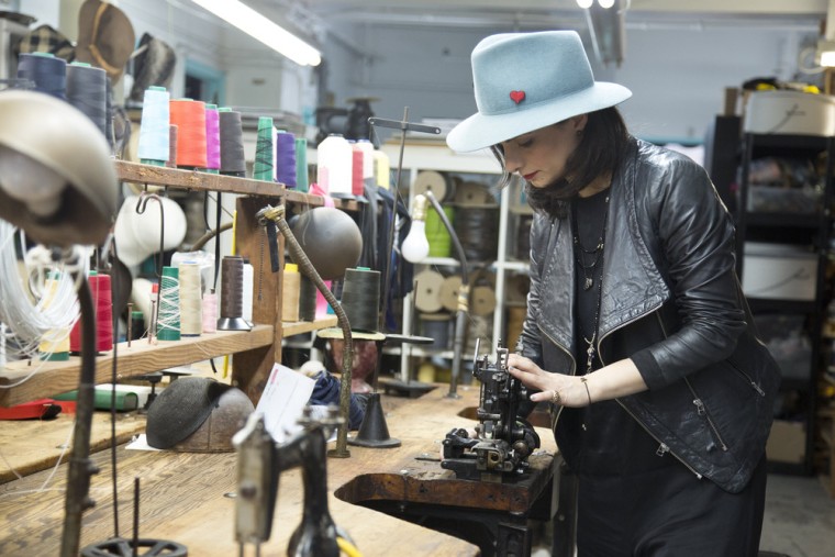 Twena at work in her factory.