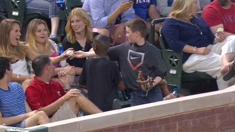 Woman takes ball from girl