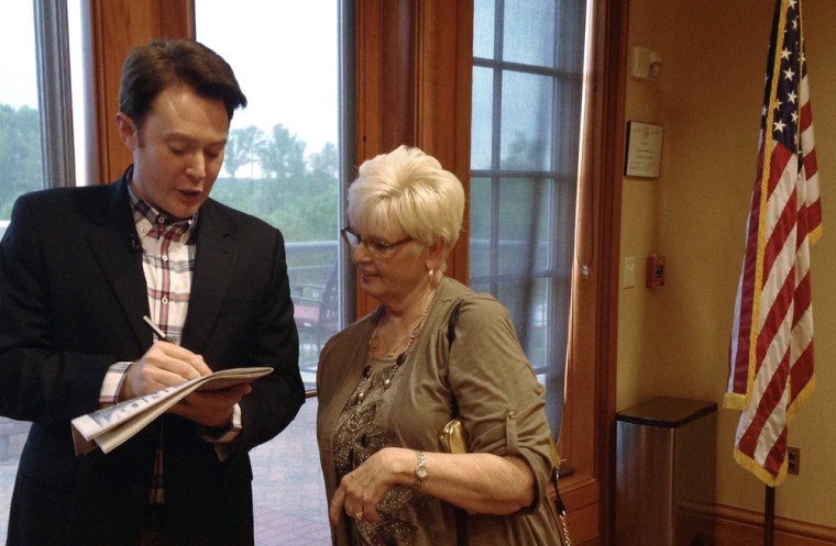 Democratic nominee Clay Aiken signs an autograph for a constituent after a campaign forum in Cary, North Carolina, April 28, 2014. The \"American Idol\"...
