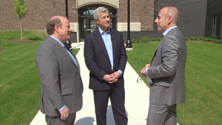 Detroit Mayor Mike Duggan (left, with Dimon, center and Lauer), called the investment \"a significant start.\"