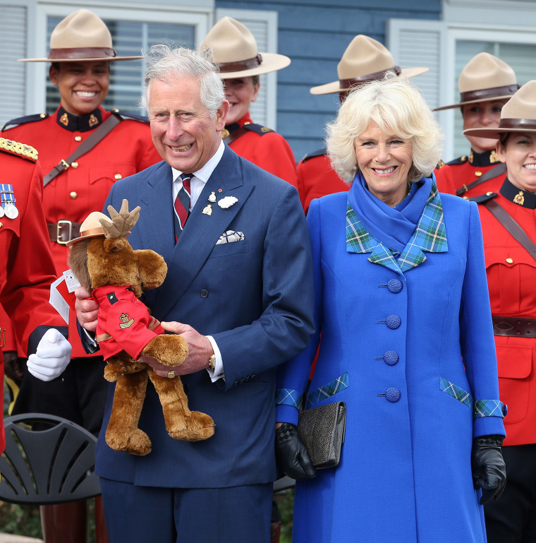Camilla, Duchess of Cornwall and Prince Charles, Prince of Wales are presented with a toy moose by the Royal Canadian Mounted P...