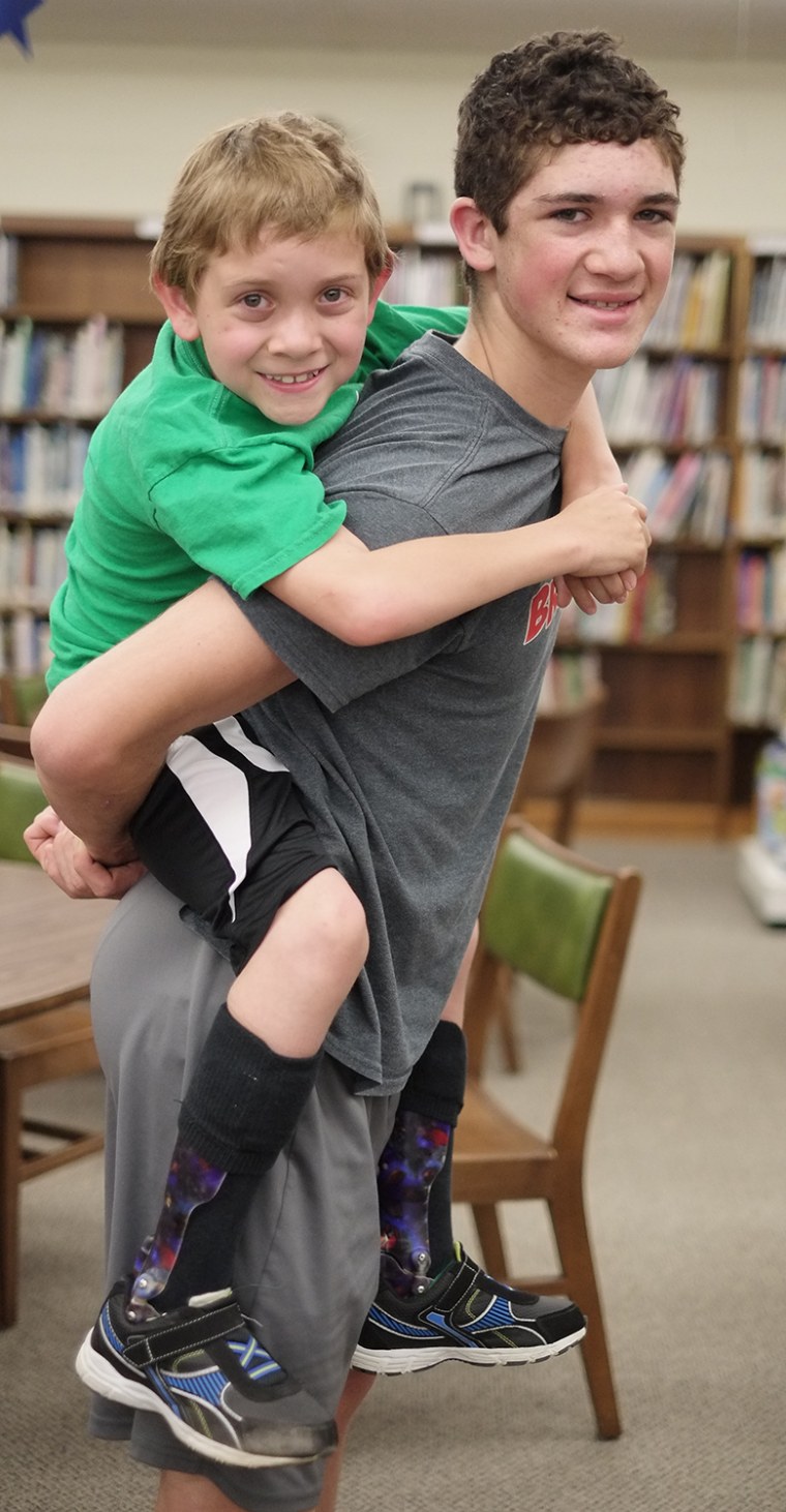 Hunter Gandee, 14, and his brother Braden Gandee, 7, Thursday, May 8, 2014, at Bedford Junior High School in Bedford, Mich. The two will be making a w...