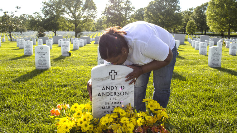 Xiomara Mena Anderson poses for a portrait next to her son Andy D Anderson's grave at Arlington National Cemetery in Arlington, Virginia on May 18, 20...