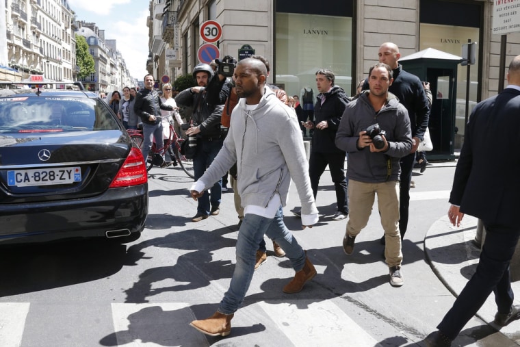 Image: Kanye West  arrives at a fashion designer shop in Paris May 22, 2014. U.S. television personality Kim Kardashian and rapper Kanye West will cel...