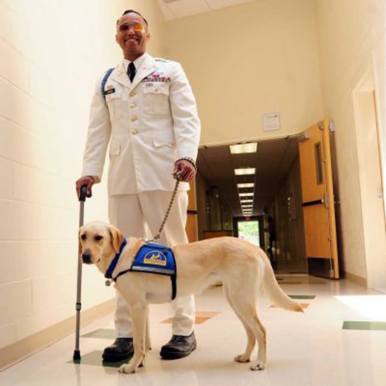 U.S. Army Capt. James Van Thach poses with his service dog, Liz.