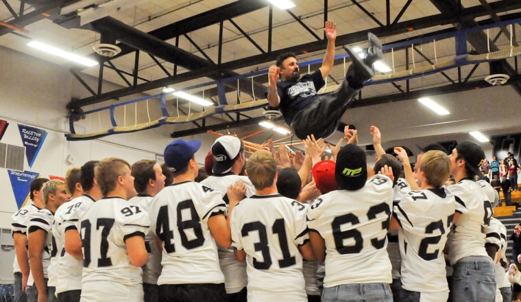 DeAngelis celebrates with his students when Columbine won the 5A state football championship.