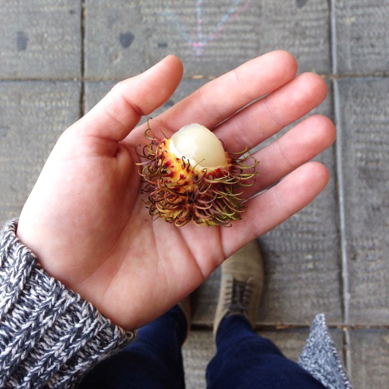 a rambutan, a fruit from Vietnam