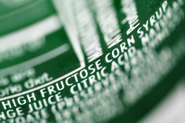 Displayed is a nutrition label on a can of soda with the ingredient high fructose corn syrup.
