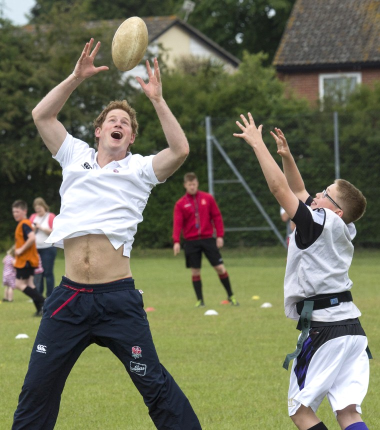 Britains Prince Harry enjoys a game of touch rugby with young children at the Inspire Suffolk centre for young people in Ipswich, eastern England, Thu...