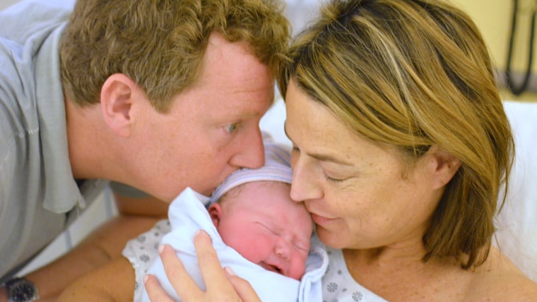 And baby makes three: New parents Mike Feldman and Savannah Guthrie with baby Vale. Her smiles make his heart \"burst with joy,\" dad writes.