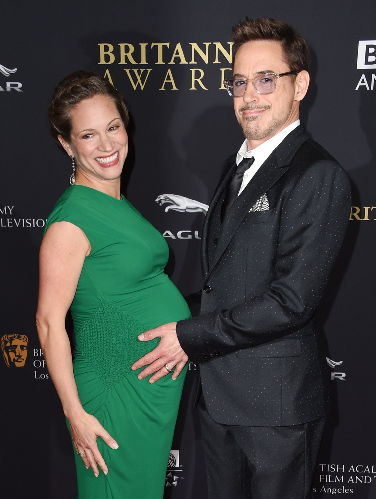 Robert Downey Jr. gets a bellyful with wife, producer Susan Downey, at the BAFTA Los Angeles Jaguar Britannia Awards.
