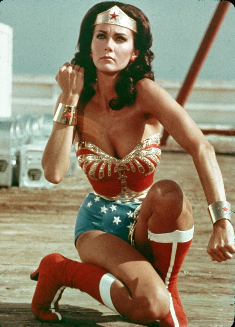 American actor Lynda Carter kneels on the ground and bears her forearm in a still from the television series Wonder Woman. (Photo by Warner Brothers/G...