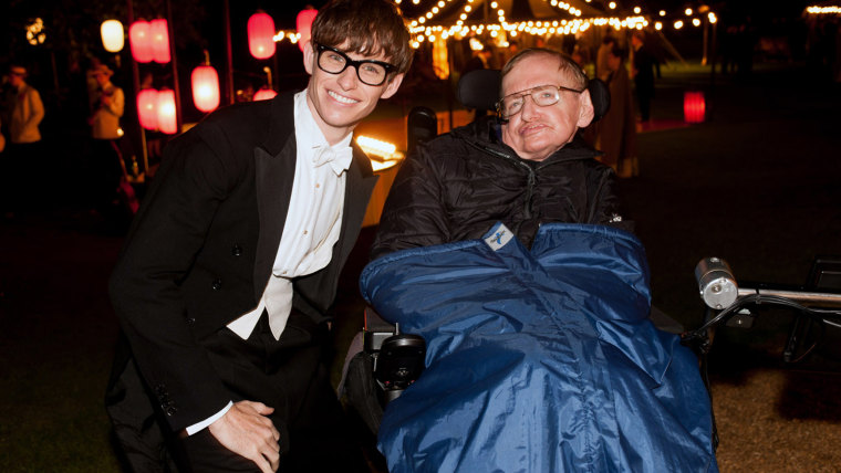 Actor Eddie Redmayne, left, poses with Stephen Hawking, who Redmayne portrays in the new movie, \"The Theory of Everything.\"