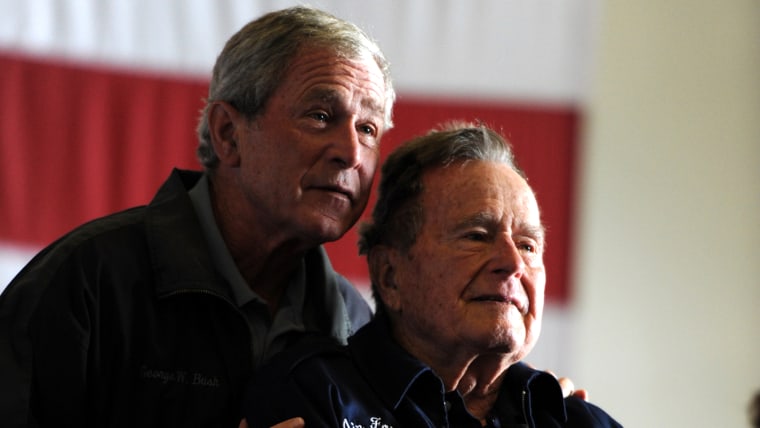 Former Presidents George W. Bush, left, and his father, George H.W. Bush.