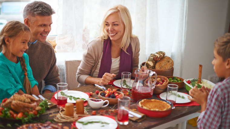 Happy family of four celebrating Thanksgiving day; Shutterstock ID 225143923; PO: TODAY.com