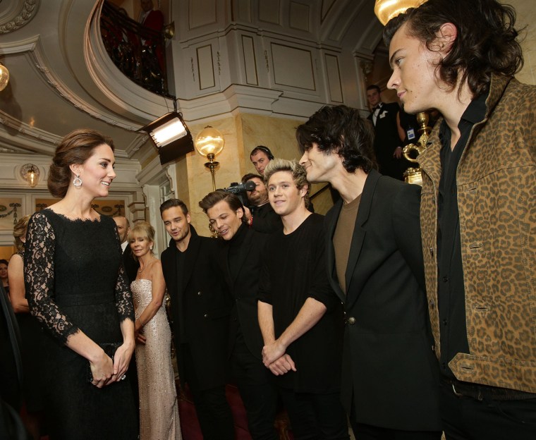 Britain's Catherine, Duchess of Cambridge (L) meets boy band, One Direction at the Royal Variety Performance at the London Palladium Theatre on Novemb...