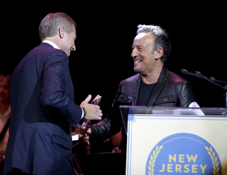 Show 'em who's boss! Bruce Springsteen greets television journalist Brian Williams at the New Jersey Hall of Fame induction ceremony on Thursday.