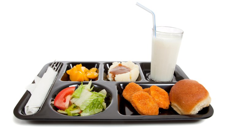 A school lunch tray on a white background with copy space; Shutterstock ID 38230963; PO: today.com