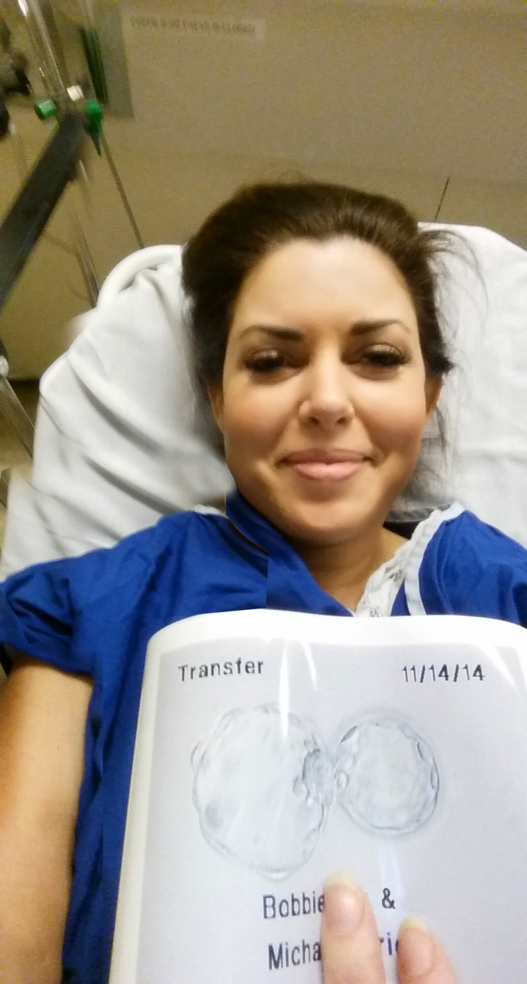 Bobbie Thomas in the hospital with a photo of the embryo that she hopes will grow into a baby. She notes she did ask her doctor, \"Umm, why are there two circles?\" She quickly said, \"It's not twins! It's just in the 'hatching' stage shedding its 'zona.'\"