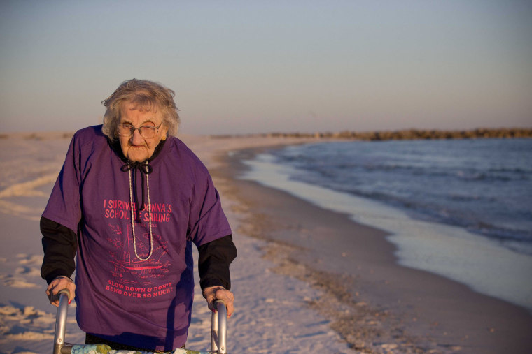 Ruby Holt, a 100-year-old Tennessee native, walks on the beach for the first time in her life Wednesday, Nov. 19, 2014, in Orange Beach, Ala. The Broo...
