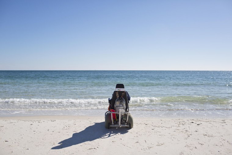 Ruby Holt, a 100-year-old Tennessee native sits in a wheel chair looking out at the ocean for the first time in her life, Wednesday, Nov. 19, 2014, in...