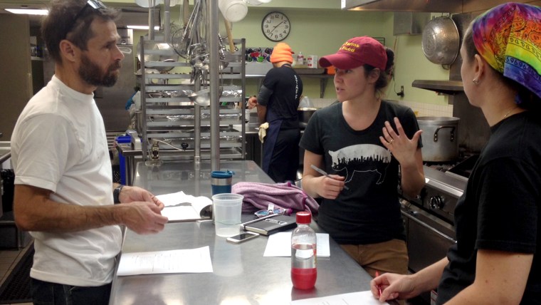 The Miriam Kitchen chefs discuss details at a weekly menu planning meeting.
