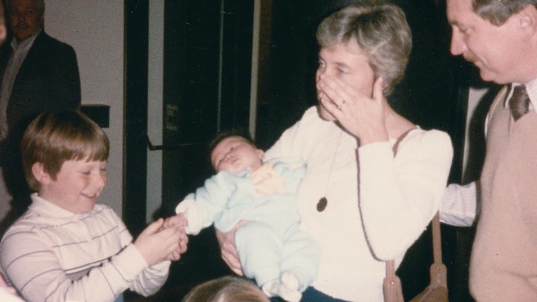 February 26, 1986. My oldest brother, Richie, holding my hand, while my other brother, Chris (blond, in front) looks on. The Cleary family is official...