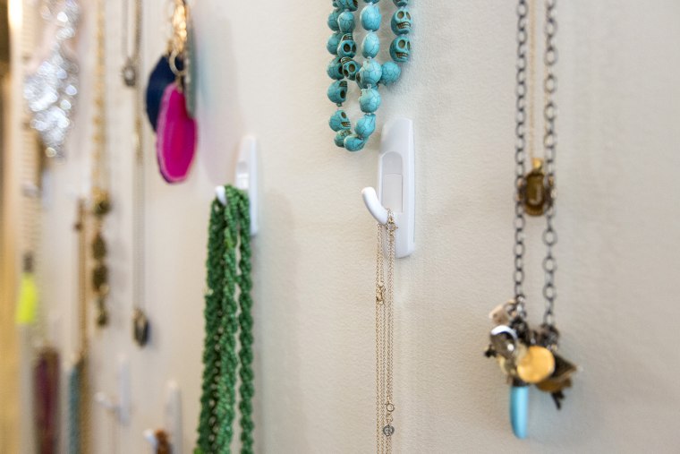 Image: Command hooks are used to organize jewelry