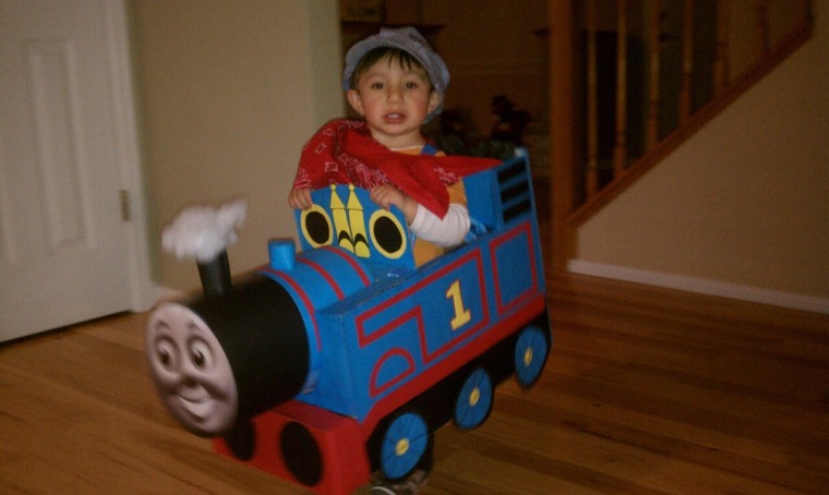 Rolling along: Annette Rivera Marquez outfitted her son as Thomas the Tank Engine, using a box, construction paper, paper plates for the wheels and a toilet paper roll for the funnel.
